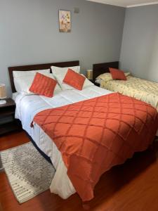 Łóżko lub łóżka w pokoju w obiekcie Hostal Esesur