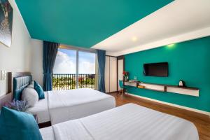 Voodi või voodid majutusasutuse Rich Hotel toas