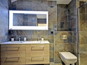 a bathroom with a sink and a mirror at Appartement rénové avec ski aux pieds, 4 chambres et prestations incluses à Courchevel - FR-1-613A-29 in Courchevel