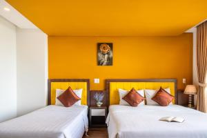 Voodi või voodid majutusasutuse Rich Hotel toas