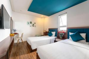 Voodi või voodid majutusasutuse Rich Hotel toas
