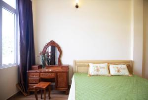 Postel nebo postele na pokoji v ubytování HUNA House