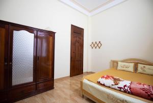Postel nebo postele na pokoji v ubytování HUNA House