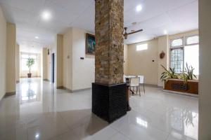 a large room with a fireplace in the middle at HOTEL BALI MAKASSAR in Makassar