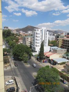 a view of a city with buildings and a street at Departamento Familiar Portales in Cochabamba
