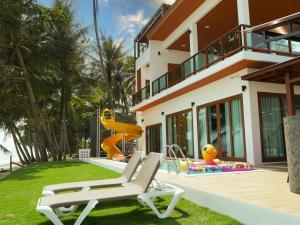 a house with a playground in the yard at KD Pool Villa @Sichon in Ban Thepha