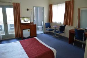Postel nebo postele na pokoji v ubytování Devere Hotel