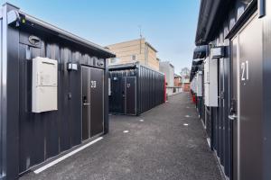 a row of garages lined up next to each other at HOTEL R9 The Yard Fujioka in Fujioka