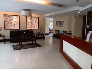 a living room with a couch and a table at Toledo Jungle, Tropicana Garden City, Sumulong Highway, Marikina City, 1800 in Manila