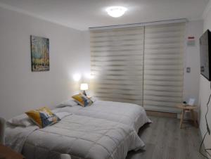 En eller flere senge i et værelse på EL REFUGIO DE FRAN en PARQUE PUCÓN ORIENTE + 19 billeder