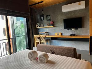 En eller flere senge i et værelse på Relife The Windy + 33 billeder