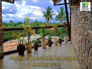 a hotel balcony with a lot of plants at Magallanes Square Hotel Inc. in Tagaytay