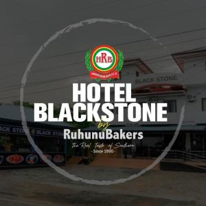 a hotel blackstone sign in front of a restaurant at Hotel Blackstone in Hambantota