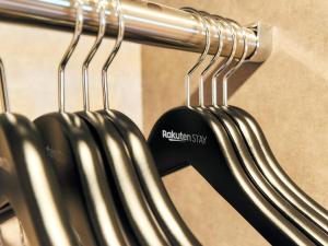 a group of hangers with a sign that reads roelandskiiry at Rakuten STAY Hakata Gion 401 Superior Room in Fukuoka