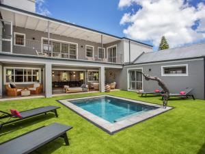 a house with a swimming pool in the yard at Bluemari's Retreat in Hout Bay