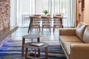 a living room with a couch and a table at Fairfield by Marriott Inn & Suites Hardeeville I-95 North in Hardeeville