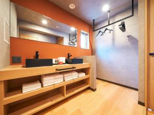 a bathroom with a sink and a mirror at Rakuten STAY Hakata Gion 501 Superior Room in Fukuoka