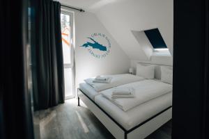 Säng eller sängar i ett rum på BrombachSeeZeit