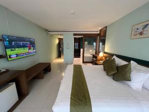 Ένα ή περισσότερα κρεβάτια σε δωμάτιο στο Siam Triangle Hotel Chiang Sean