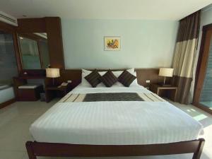 Ένα ή περισσότερα κρεβάτια σε δωμάτιο στο Siam Triangle Hotel Chiang Sean