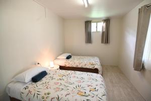 Voodi või voodid majutusasutuse Lazy Days Caravan Park toas