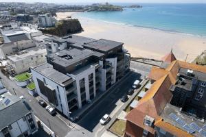 an aerial view of a city and the beach at 34 Cliff Edge 2nd floor Newquay luxury sea-view residence in Newquay