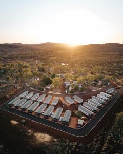 an aerial view of a parking lot with cars at Tom Price Tourist Park in Tom Price