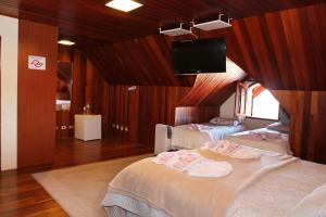 Postel nebo postele na pokoji v ubytování Pousada Recanto Sião