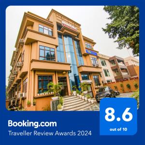 a rendering of aominium building with the words travel review awards at FabHotel Prime The Rivlet MG Road in Gurgaon