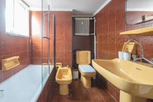 a bathroom with a sink and a toilet and a shower at Open -view Apartment, YGEIA Hospital in Athens