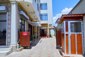 an empty street in a city with buildings at KILI CRANE LODGE ARUSHA in Arusha