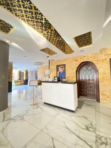 an office with a reception desk in a lobby at The RN Hotels in Wadi Musa