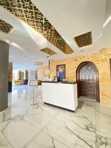 an office with a reception desk in a lobby at The RN Hotels in Wadi Musa +32 photos
