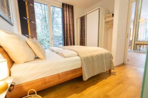 Postel nebo postele na pokoji v ubytování Residenz - Lichtermeer - Seeterrasse - Sauna - Parkplatz