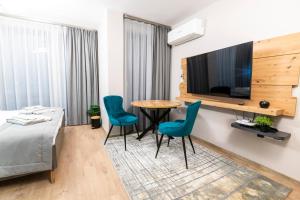 TV a/nebo společenská místnost v ubytování Apartmenthaus Oborishte