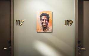 a picture of a man hanging on a door at AMERON Hamburg Hotel Speicherstadt in Hamburg