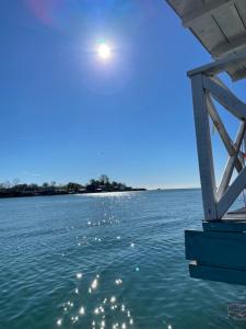 a view of the water from under a pier at Stella Marina in Pržno