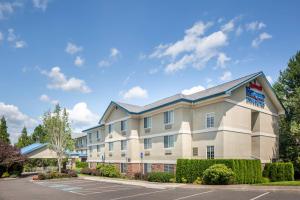 an image of a hotel with a parking lot at Fairfield Inn & Suites Portland West Beaverton in Beaverton