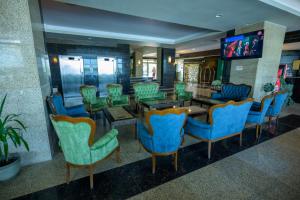 Una televisión o centro de entretenimiento en Hotel Esplanada
