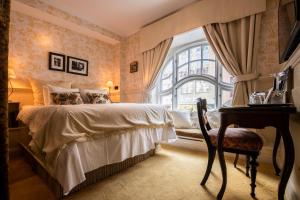 Voodi või voodid majutusasutuse Hotel Pigalle toas