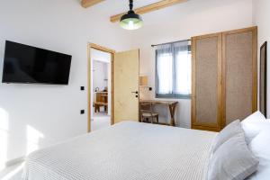 Postel nebo postele na pokoji v ubytování ANGONI SUITES