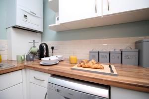 a kitchen with a cutting board with chickens on a counter at Cohost Partners: Perfect Retreat in Bristol in Bristol