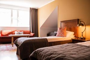 Postel nebo postele na pokoji v ubytování Sundvolden Hotel