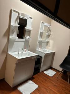 a bathroom with two sinks and two mirrors at base sanablend - Vacation STAY 37411v in Kyotango