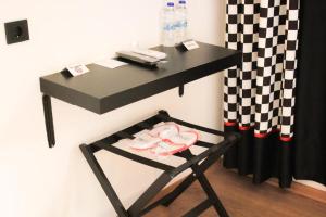 a black table with a chair and a black desk at THINK HOTEL in Konya