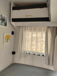 a window in a room with a rv at Kemping pod figą in Granichar