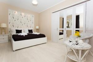 Postel nebo postele na pokoji v ubytování RELAXING HOME LUCE + 29 fotografií