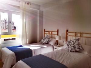 A bed or beds in a room at La luz de triana
