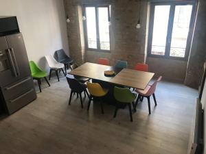 a dining room with a table and chairs at Au billot Chanteloup in Charlieu