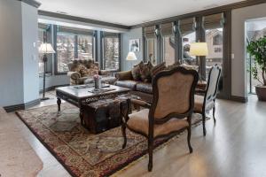 a living room with a couch and a table at Beaver Creek Lodge 512 in Beaver Creek